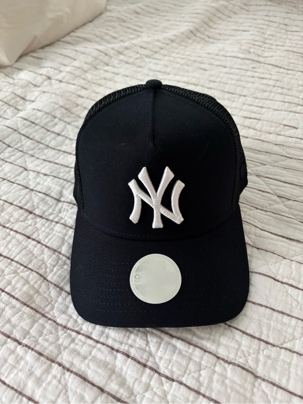 Aritzia Womens Black Trucker Hat with White Logo
